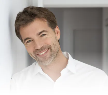 Man in a white shirt smiling