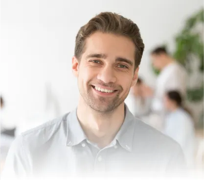 Man smiling in a grey shirt